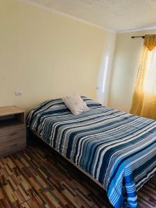 Postel nebo postele na pokoji v ubytování Departamento amoblado calama