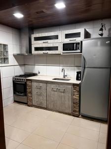 Kuchyň nebo kuchyňský kout v ubytování Casa por temporada
