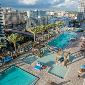 an aerial view of the pool at a resort at Stunning Beachfront 3-Bedroom Corner Residence in Hollywood +67 photos