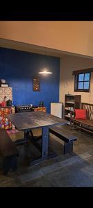 a large table in the middle of a room at Poente Guest House in Conceição da Ibitipoca
