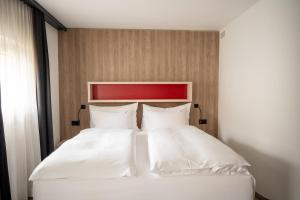 Voodi või voodid majutusasutuse Boutiquehotel Thessoni Classic & Self service Residence Home Zürich toas