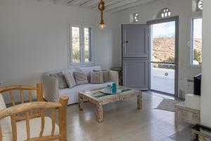 a living room with a couch and a table at KVilla Comfort Living in Triandáros