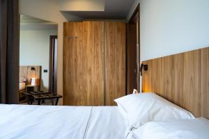 Postel nebo postele na pokoji v ubytování La Molgora Hotel
