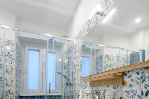 a bathroom with a shower and a sink at "A casa dei Nonni" House near the metro C in Rome +35 photos