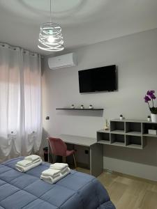 Μια τηλεόραση ή/και κέντρο ψυχαγωγίας στο ILBE bed & breakfast +56 φωτογραφίες