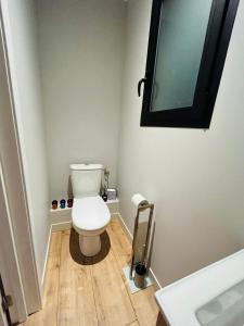 a small bathroom with a toilet and a sink at Hôtes Cardo in Bastia +6 photos