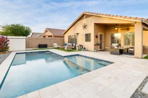 a swimming pool in the backyard of a house at Desert Oasis with Outdoor Living in Goodyear! in Liberty