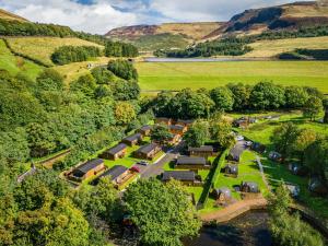 an aerial view of a village in the hills at Lakeside Pods - pets welcome in Oldham