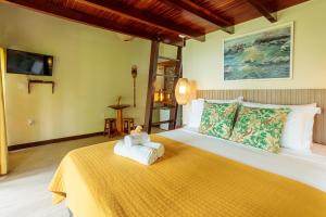 Cama ou camas em um quarto em Pousada Lagamar