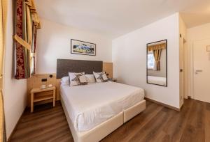 Posteľ alebo postele v izbe v ubytovaní Hotel Plank