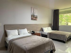 Postel nebo postele na pokoji v ubytování Fortune Hotel + 27 fotografií