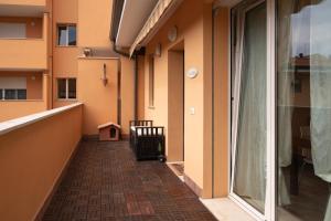 an empty hallway of a building with a window at A casa di Gio e Fede in Rimini