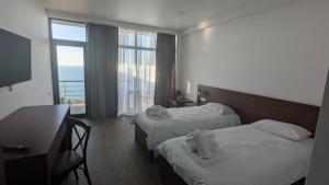 Katil atau katil-katil dalam bilik di Mari's hotel sarfi