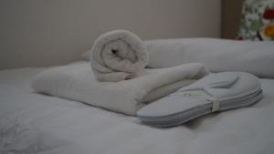 a towel on a bed with a towel at House of AlAy in Künzelsau