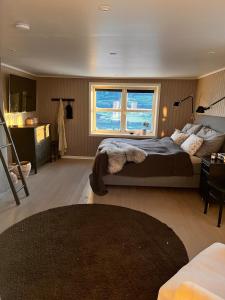 a bedroom with a large bed and a window at Fairy tale house during Ski world cup in Melhus +77 photos