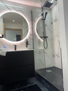a bathroom with a sink and a mirror at Ciné &chill in Mulhouse +10 photos