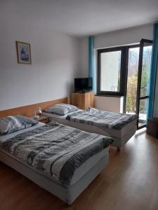 Posteľ alebo postele v izbe v ubytovaní Pokoje Gościnne MONIKA + 18 fotografií