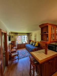 a living room with a couch and a table at Departamento en Pucón - Camino al Volcan in Pucón