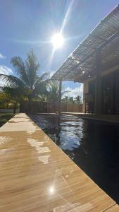 Kolam renang di atau dekat dengan Bangalô com piscina - Japaratinga