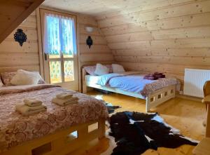 Postel nebo postele na pokoji v ubytování CypiSówka