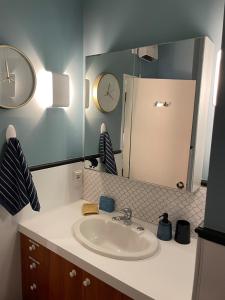 a bathroom with a sink and a mirror at Habeke Bothy - epic views - 700mtrs to town in Queenstown +36 photos