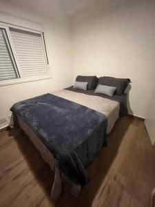 Ένα ή περισσότερα κρεβάτια σε δωμάτιο στο ECOVILLE AP