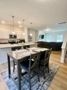 a kitchen and dining room with a table and chairs at Luxury Living! Peaceful,Comfort and Spacious in Winston-Salem