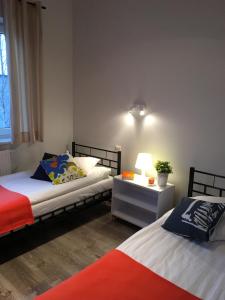 Posteľ alebo postele v izbe v ubytovaní Arcus Premium Hostel