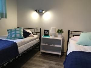 Posteľ alebo postele v izbe v ubytovaní Arcus Premium Hostel