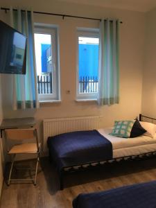 Posteľ alebo postele v izbe v ubytovaní Arcus Premium Hostel