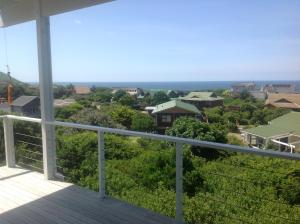 a view from the balcony of a house at By the Sea Vacation Home in Brenton-on-Sea