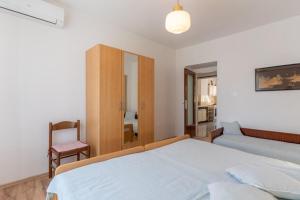 Posteľ alebo postele v izbe v ubytovaní Apartment Mici 1