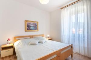 Posteľ alebo postele v izbe v ubytovaní Apartment Mici 1