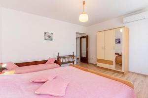 Posteľ alebo postele v izbe v ubytovaní Apartment Mici 1