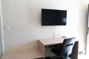 TV a/nebo společenská místnost v ubytování Dunas Hospedaje