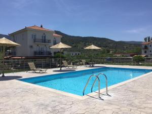 a swimming pool in front of a villa at Villa Vicky in Petra