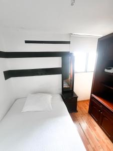 Postel nebo postele na pokoji v ubytování Hotel Yellow Maraya, Pereira