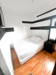 Postel nebo postele na pokoji v ubytování Hotel Yellow Maraya, Pereira
