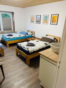 Postel nebo postele na pokoji v ubytování Ferienhaus Sophie - ideal für Familie & Monteure + 11 fotografií