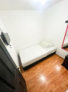 Postel nebo postele na pokoji v ubytování Hotel Yellow Maraya, Pereira