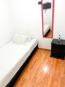 Postel nebo postele na pokoji v ubytování Hotel Yellow Maraya, Pereira