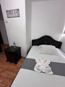 Postel nebo postele na pokoji v ubytování Hotel Yellow Maraya, Pereira