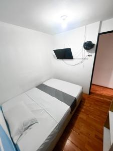 Postel nebo postele na pokoji v ubytování Hotel Yellow Maraya, Pereira