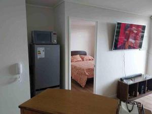 Ένα ή περισσότερα κρεβάτια σε δωμάτιο στο Departamento en osorno