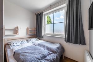 Postel nebo postele na pokoji v ubytování Lipno nad Vltavou - Slupečná - apartmán Jana u lesa u sjezdovky