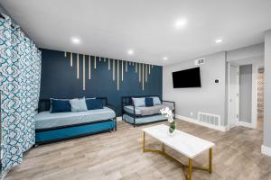 a living room with a bed and a couch at Fully Equipped 1BR with King Bed, Pool & Free Parking in Houston