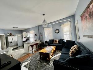 a living room with a couch and a table at Kailyn Apartment Boston, Massachusetts in Boston