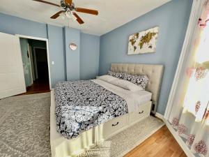 a bedroom with a bed and a ceiling fan at Kailyn Apartment Boston, Massachusetts in Boston