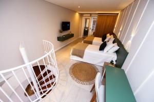 Μια τηλεόραση ή/και κέντρο ψυχαγωγίας στο BLESSED Lofts, modernos Lofts no melhor bairro da cidade de Itajai, SC