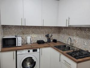 Kuchyň nebo kuchyňský kout v ubytování Apartment Oxalis